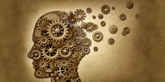 A silhouette of a human head formed by interlocking gears of various sizes. Some gears are detaching and floating to the right, against a textured, sepia-toned background, suggesting a theme of thoughts or mechanisms of the mind.