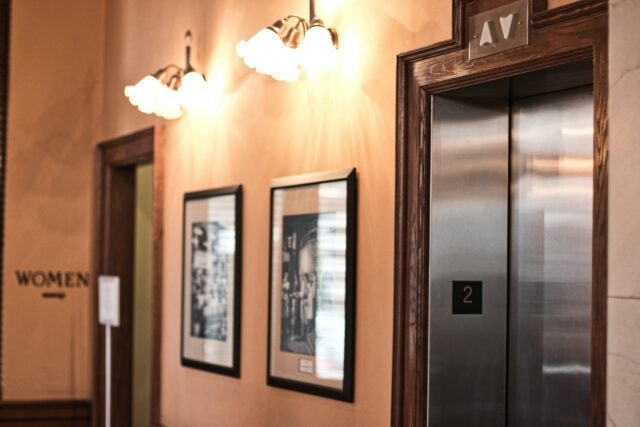 A hallway in New Jersey features an elevator on the right, prominently marked 